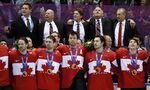 Canada players and coaches sing the national anthem after being awarded their gold medals after they beat Sweden 3-0 in the men's ice hockey gold medal game at the 2014 Winter Olympics, Sunday, Feb. 23, 2014, in Sochi, Russia. Four years after walking away with a bronze medal after the NHL did not participate, Canada's team in Beijing has remnants of the ones that won gold in 2010 and 2014 and a roster that looks capable of doing it again. (AP Photo/Mark Humphrey, File)