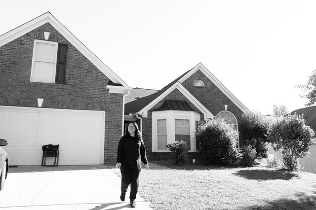 Ovares walks outside her home in Dacula. 