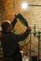 Winemakers evaluate and restore vintage bottles of Champagne.