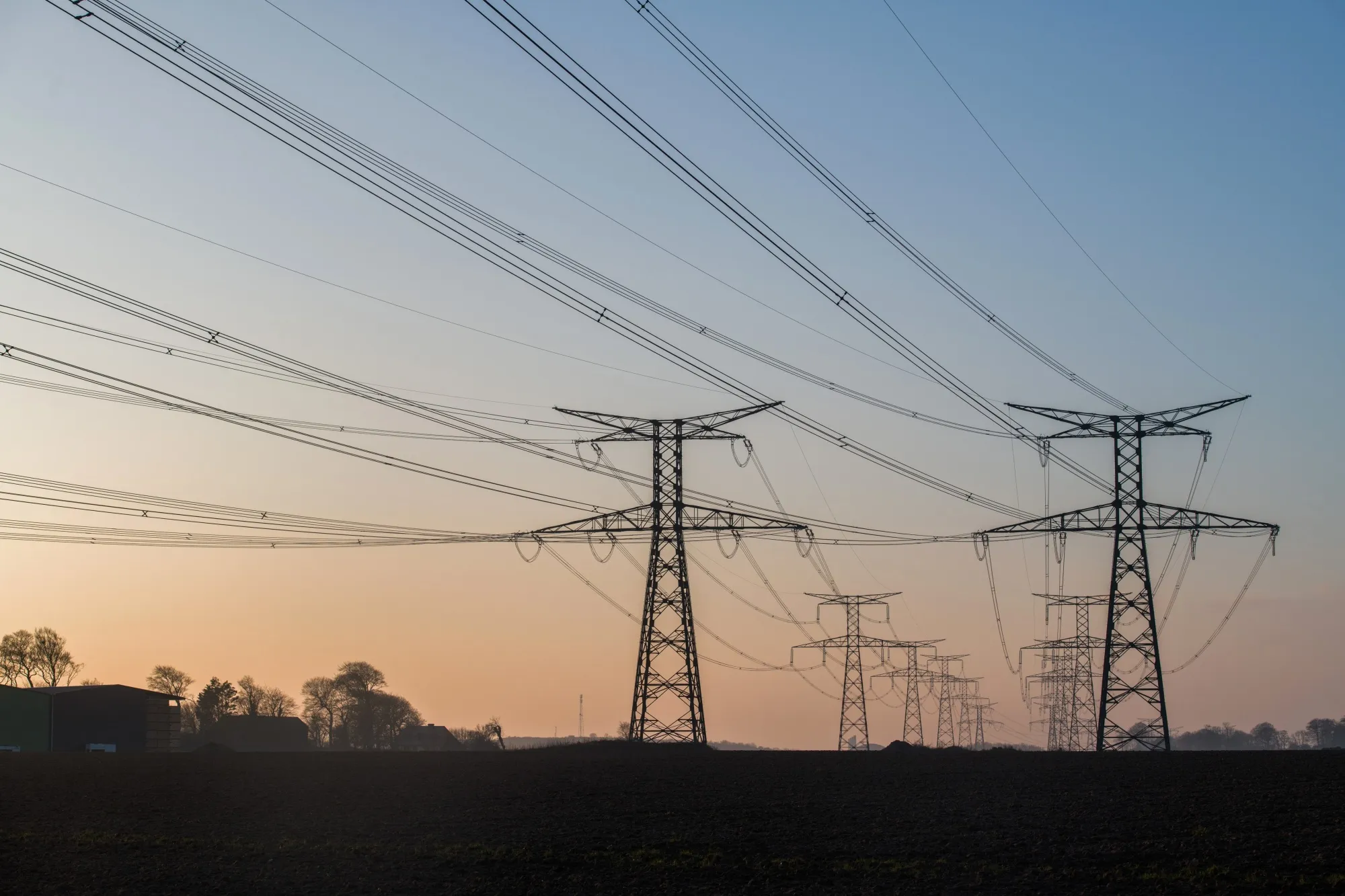Electricity pylons and power lines near a power plant in Paluel, France.