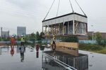 A crane lowers a KUBio module into place in Biolake Science Park in Wuhan.
