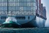 A tugboat guides the Kawasaki Kisen Kaisha Ltd. Bai Chay Bridge cargo ship into the Port of Long Beach in Long Beach, California, U.S., on Wednesday, April 4, 2018. The U.S. trade deficit widened by more than forecast to a fresh nine-year high in February amid broad-based demand for imports, ahead of Trump administration tariffs that have raised the specter of a trade war.