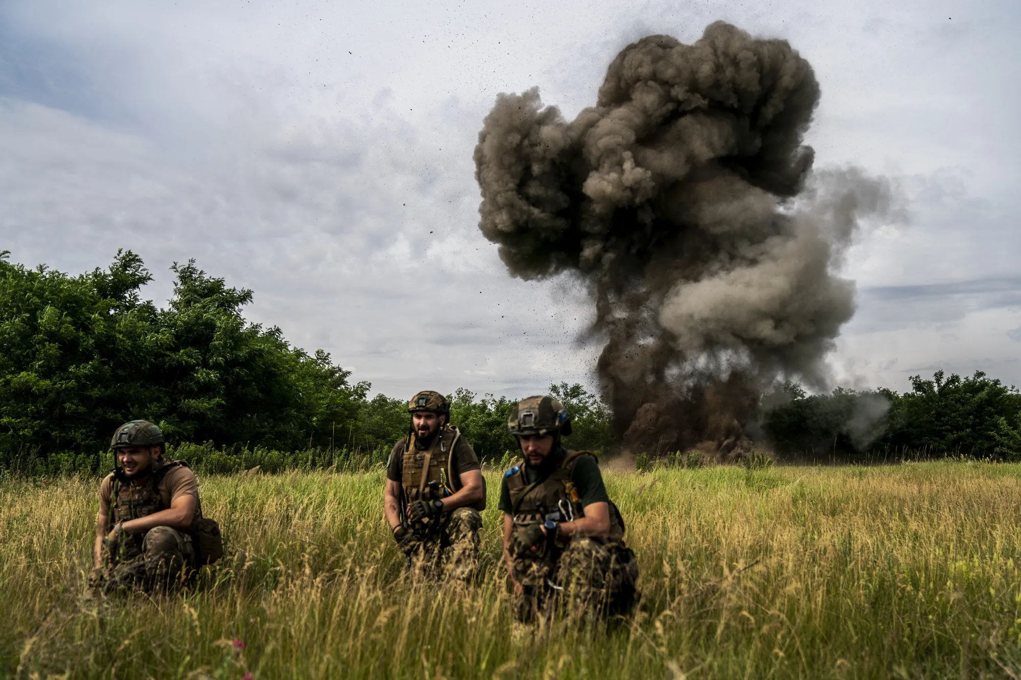 Ukrainian soldiers take&nbsp;cover during mine and shell detonation work in Donetsk region, Ukraine on&nbsp;June 15.