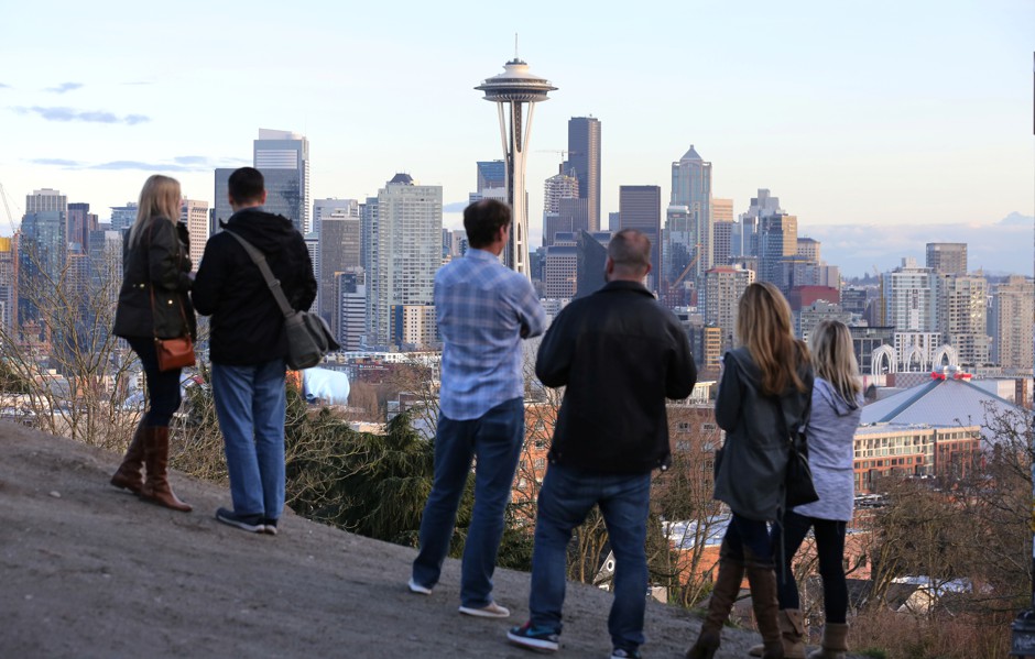 People view the skyline of tech hub Seattle, which was one of the few large metro areas with significant real wage gains between 2012 and 2016.