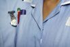 UK, Close-up of two typically dressed NHS (National Health Service) nurses