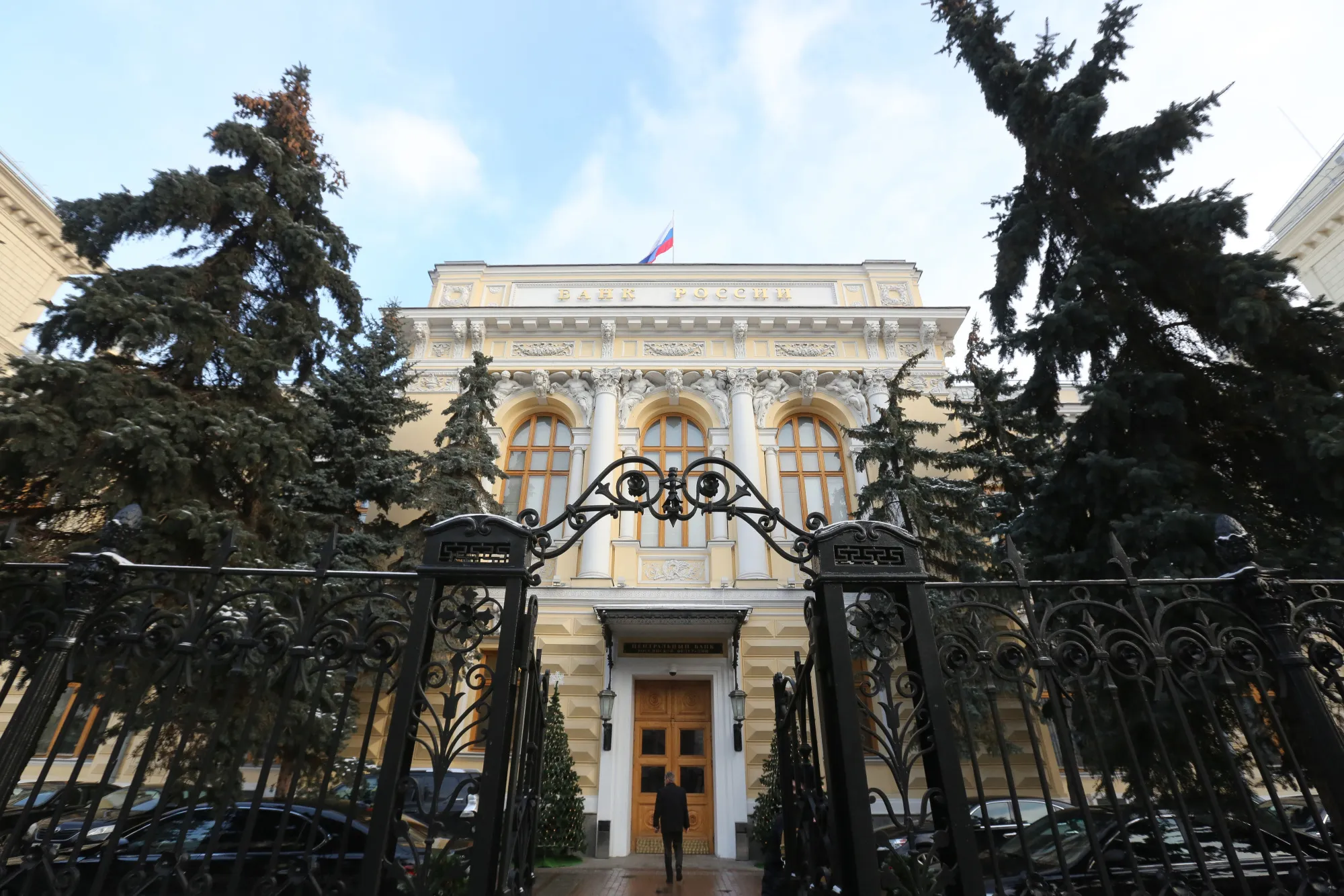 A visitor approaches the headquarters of the Russian central bank, also known as Bank Rossii, in Moscow, Russia, on Friday, Dec. 16, 2016.
