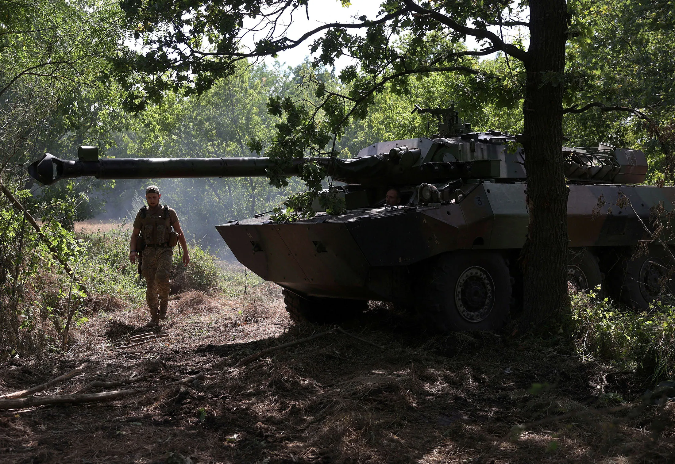 Ukrainian marines inspect an&nbsp;armored fighting vehicle at a position in the Donetsk region on July 10.