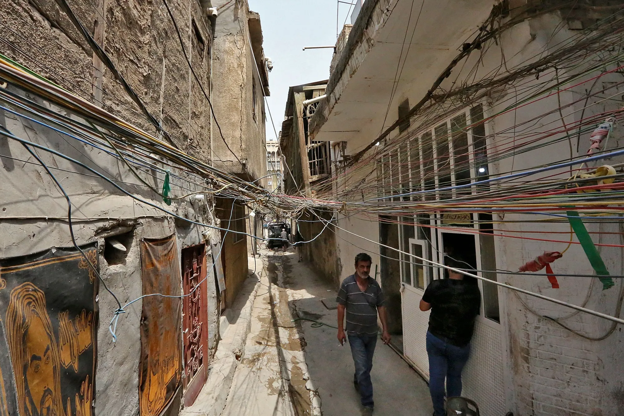 Electrical wires running between homes in Baghdad, Iraq.