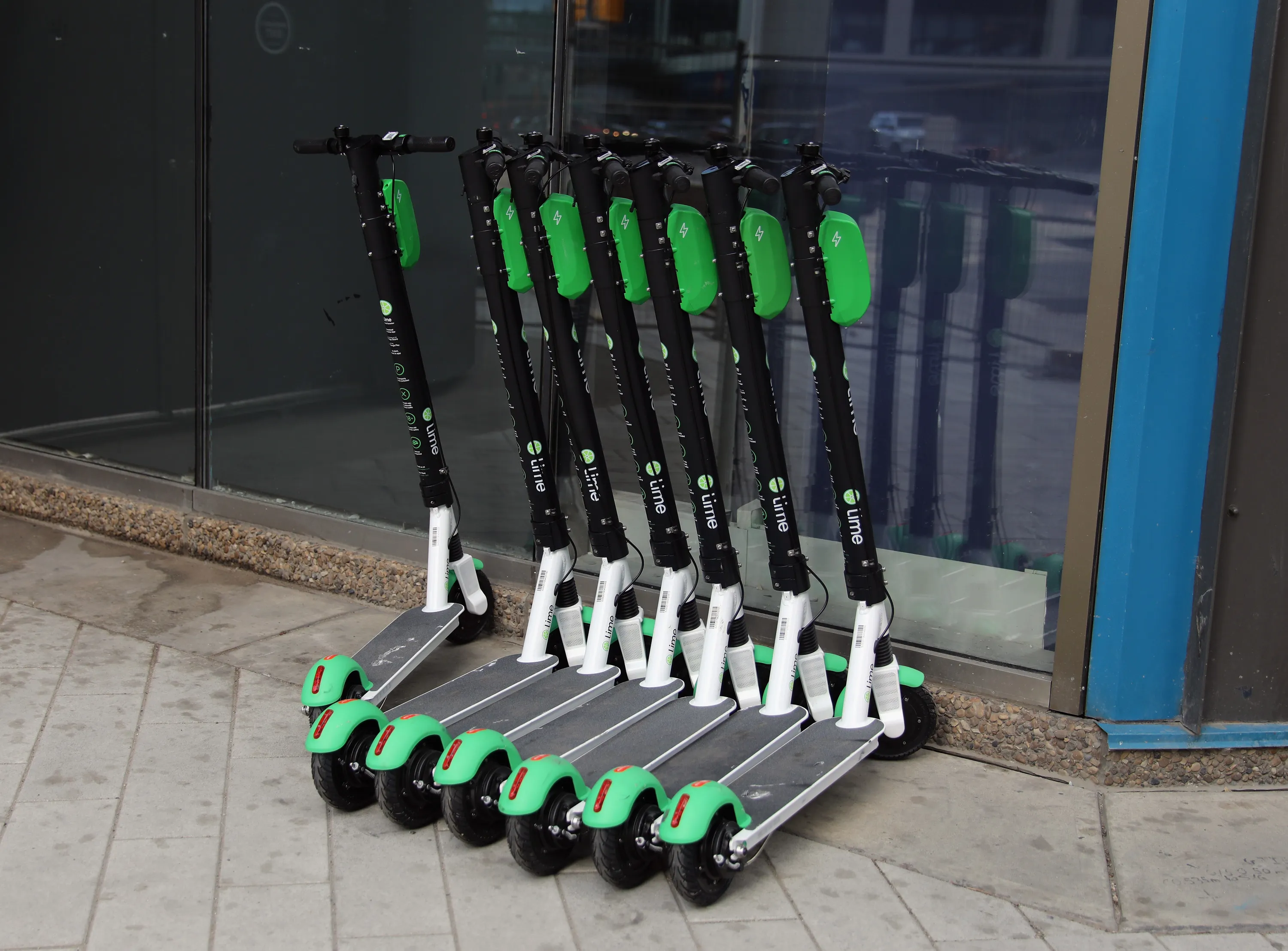 Lime scooters line the sidewalk&nbsp;in Edmonton, Alberta, in August.&nbsp;