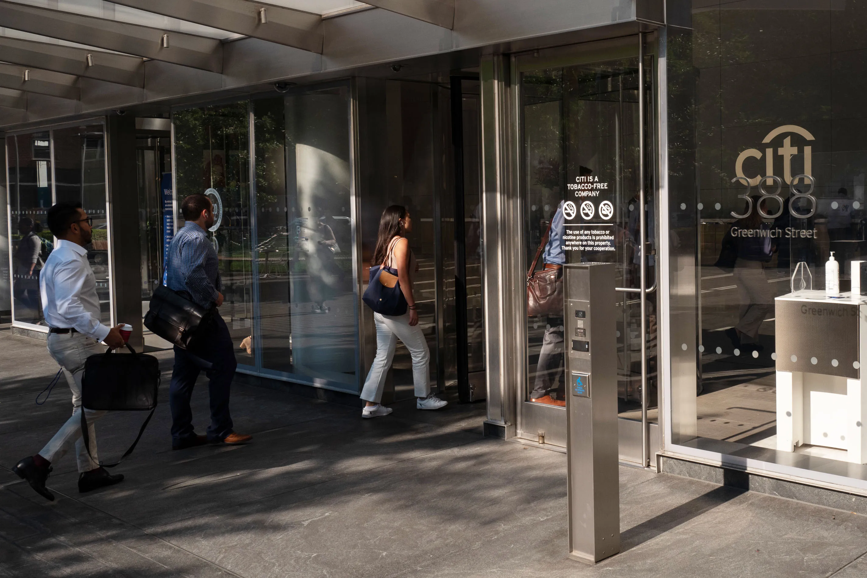 Workers enter Citigroup headquarters in New York.