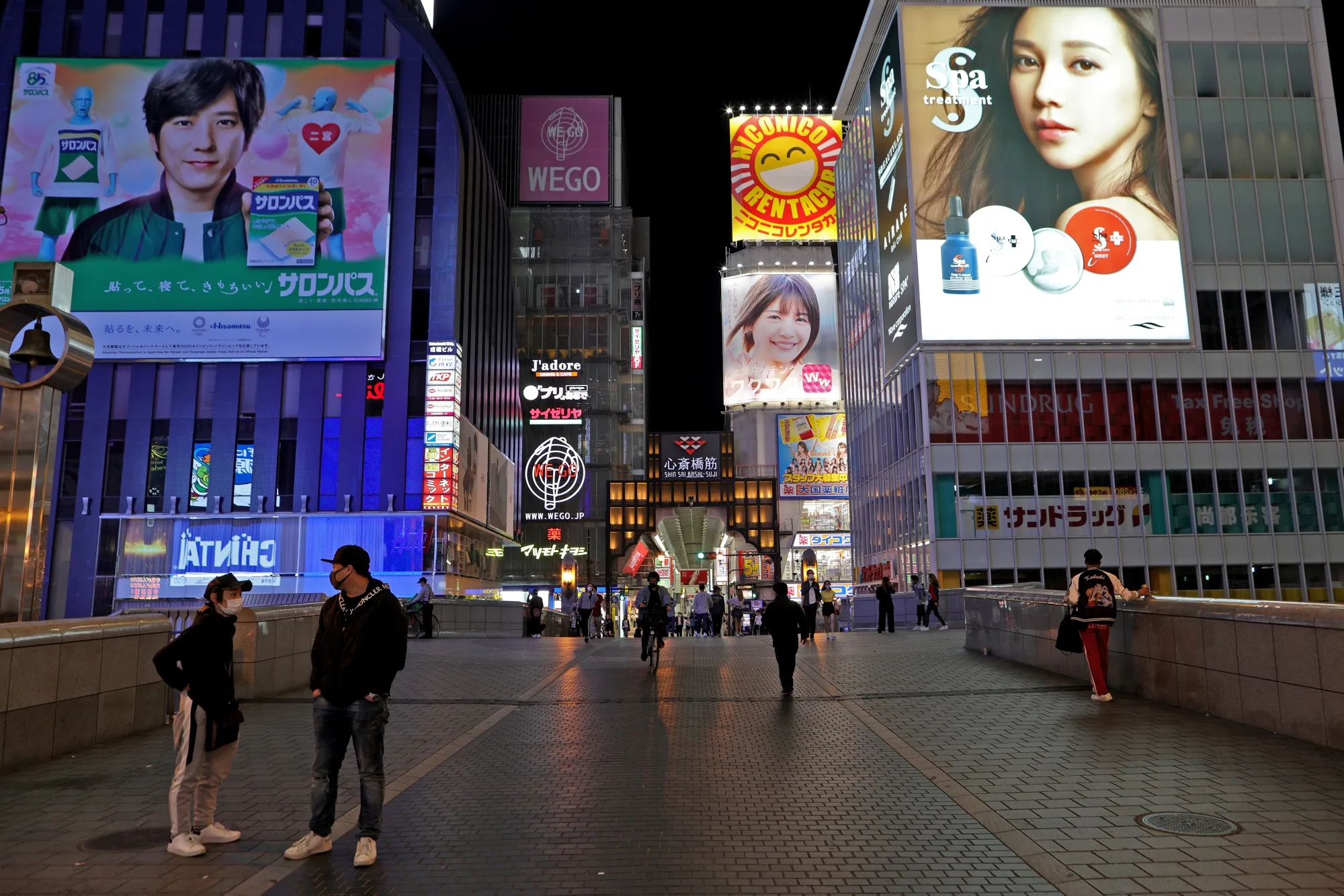 Pedestrians walk on a bridge in Osaka, Japan on May 2.