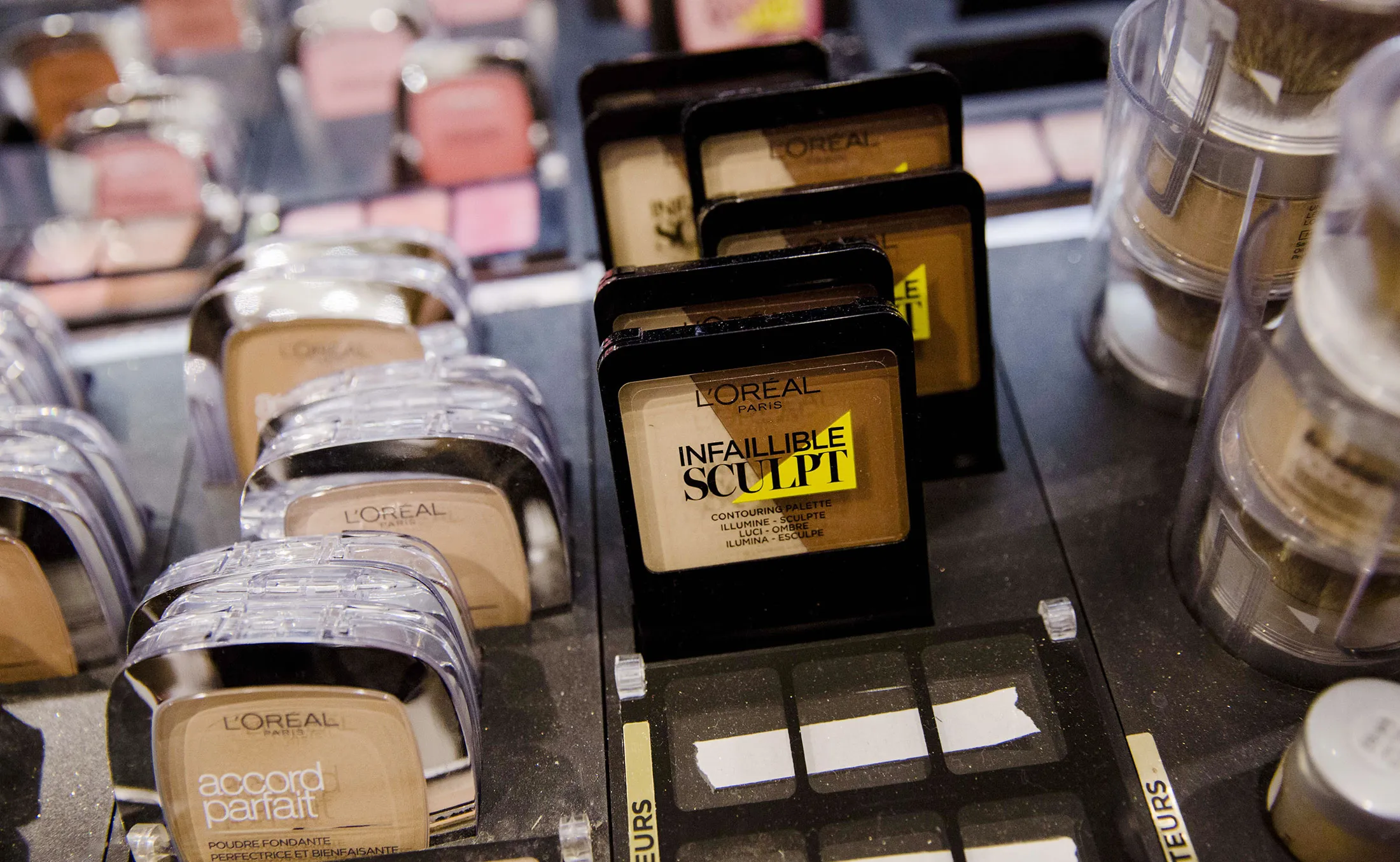 L'Oreal cosmetic products sit on display in a department store in Paris, France.
