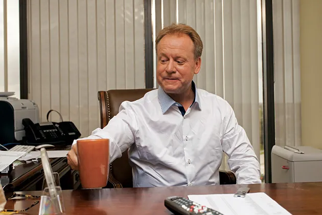 .XXX founder Stuart Lawley working in his Jupiter, Fla., office