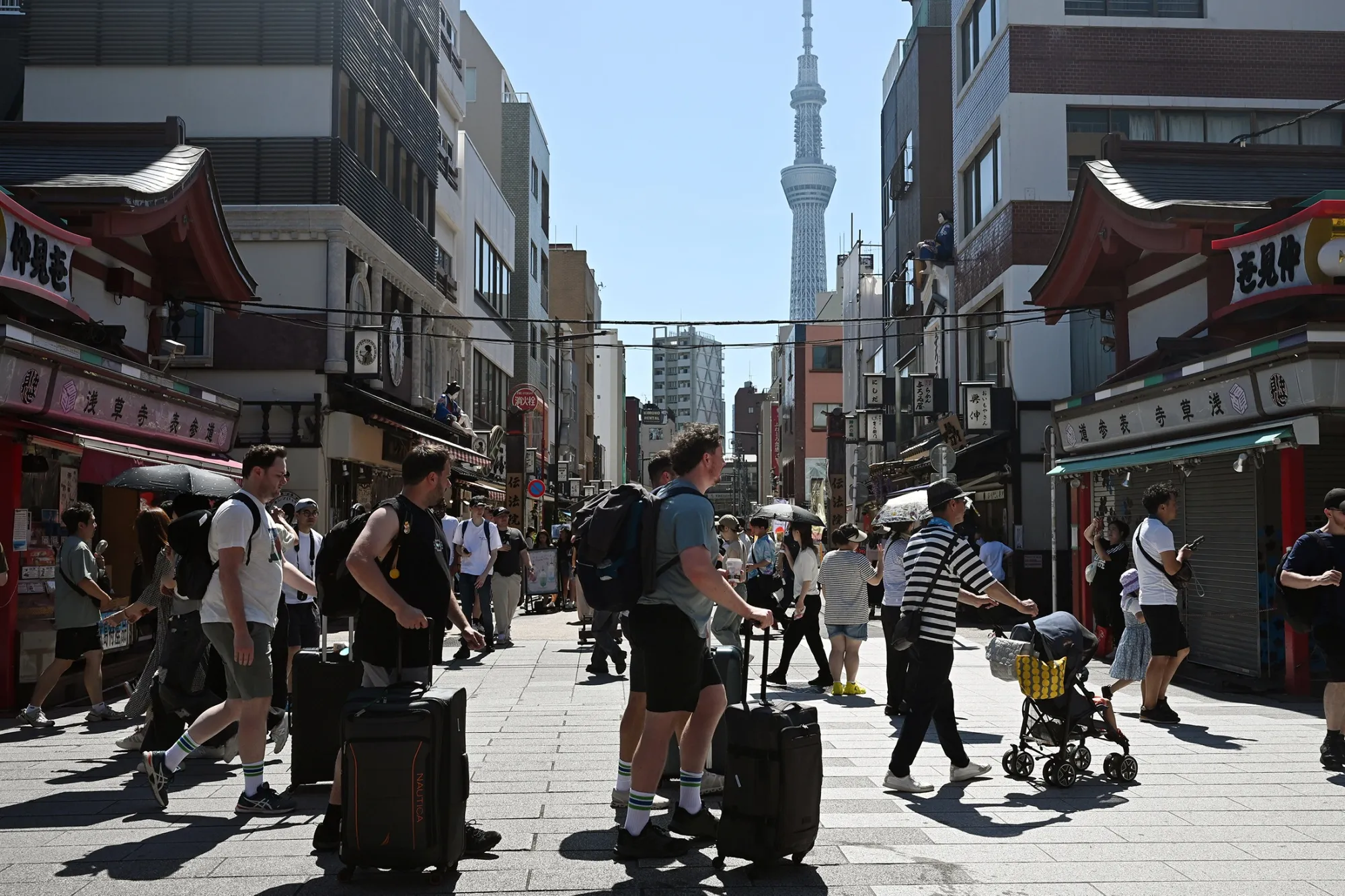 Tourists on Nakamise shopping street, the main approach to Sensoji Temple, in the Asakusa district of Tokyo on June 22.