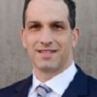 Headshot of Craig J Mariam