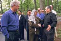 Bill Clinton, Yasser Arafat and Ehud Barak on the opening day of the 2000 Camp David talks. Source: White House Photo/Newsmakers via Getty Images