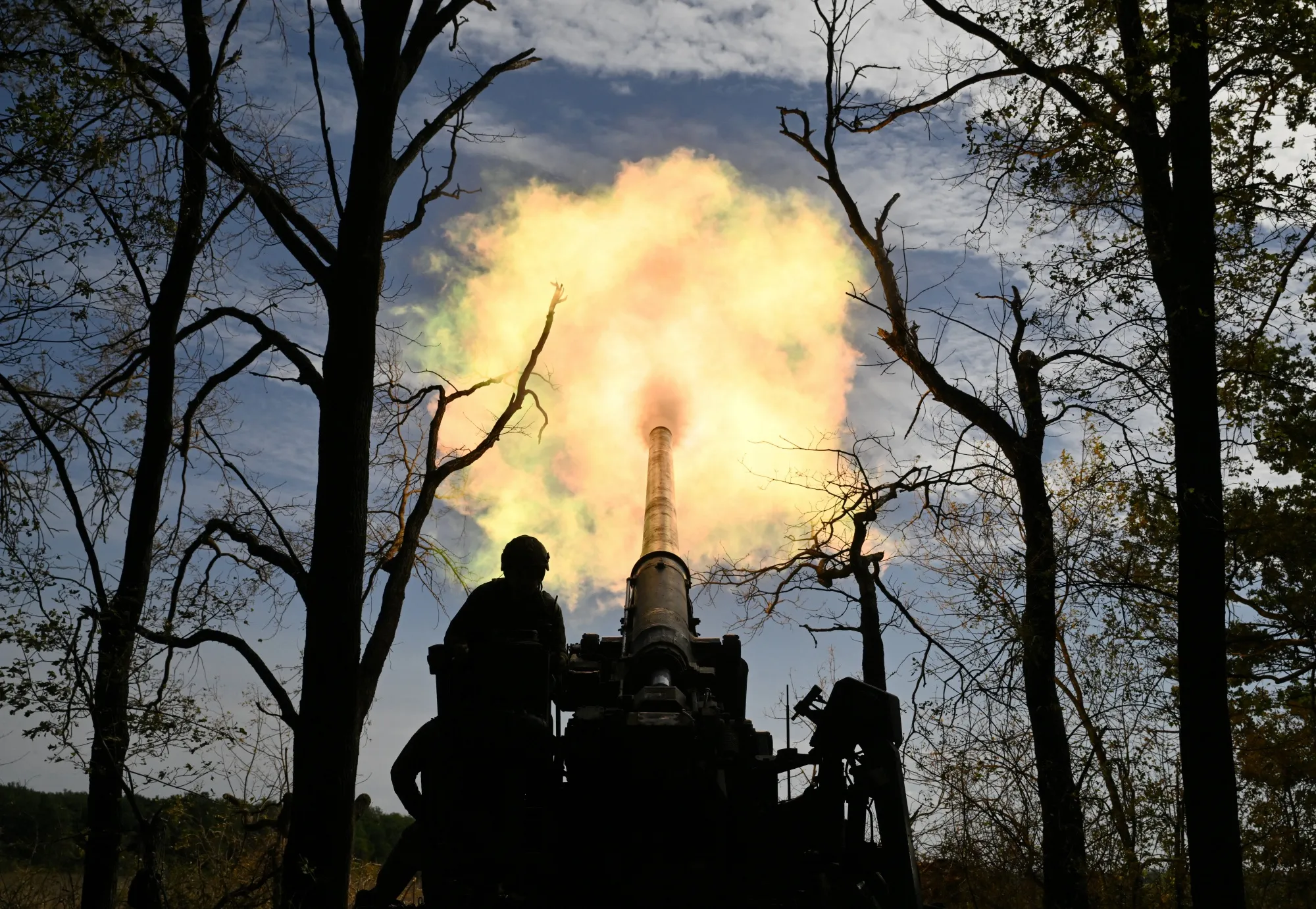 Ukrainian servicemen operate artillery at a front line position in Donetsk region in September.