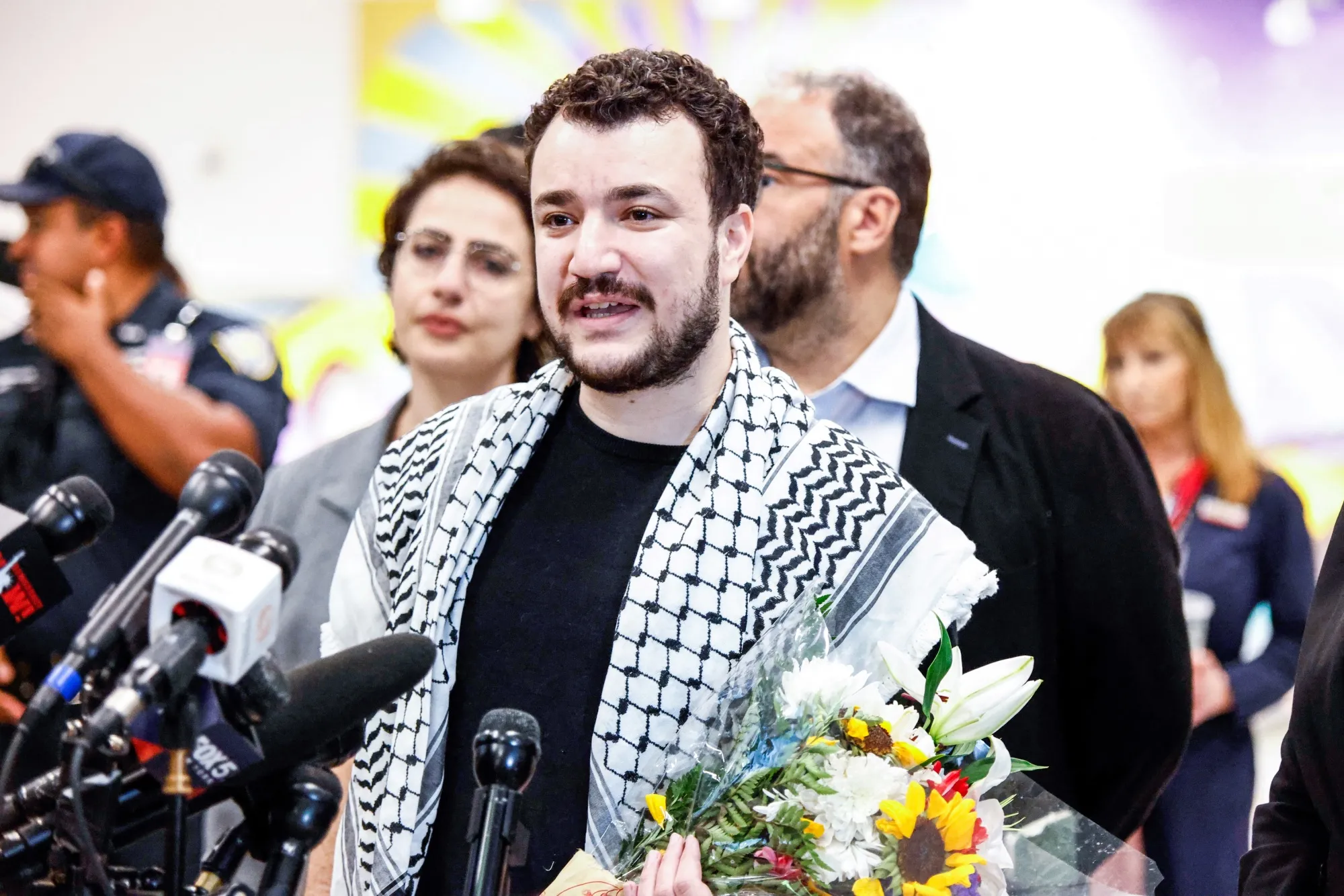 Former Columbia Univrsity student Mahmoud Khalil speaks to the press as he arrives at Newark airport in Newark, New Jersey, on June 21.