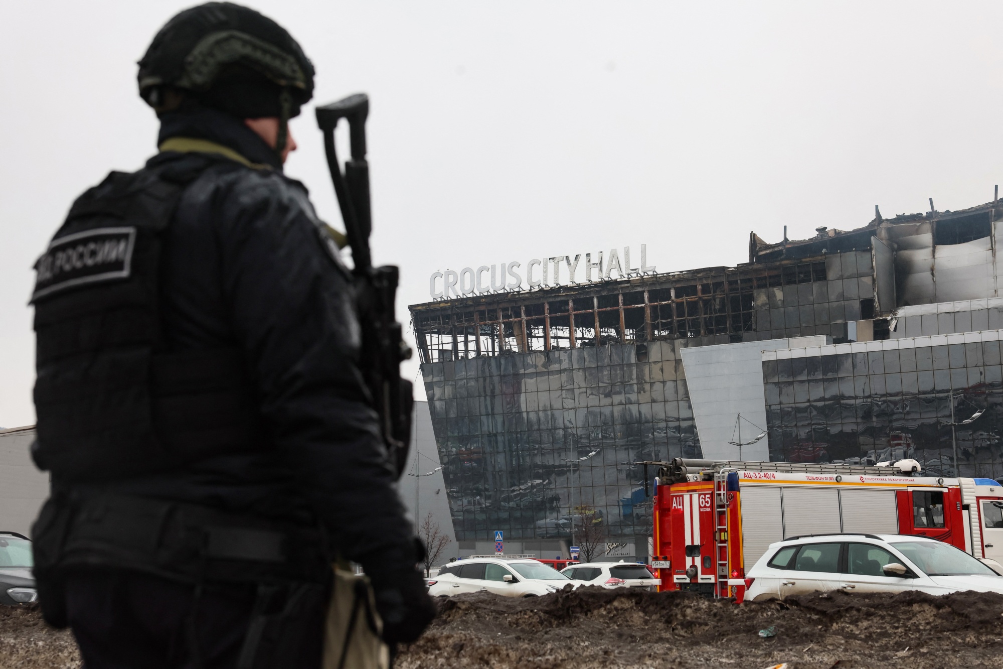 A law enforcement officer patrols the scene of the gun attack at the Crocus City Hall concert hall in Krasnogorsk, outside Moscow, on March 23.
