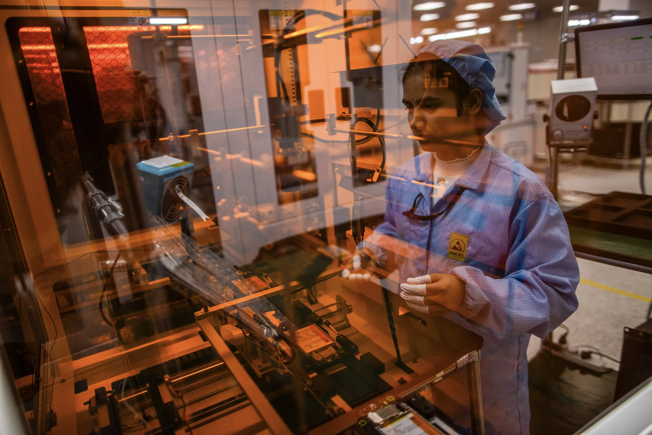 A mobile phone assembly line at a subsidiary of Dixon Technologies in Noida.