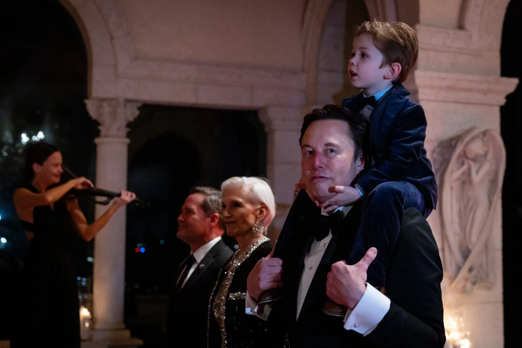 Elon Musk arrives at Mar-a-Lago Club with his mother, Maye, and his son on New Year’s Eve.