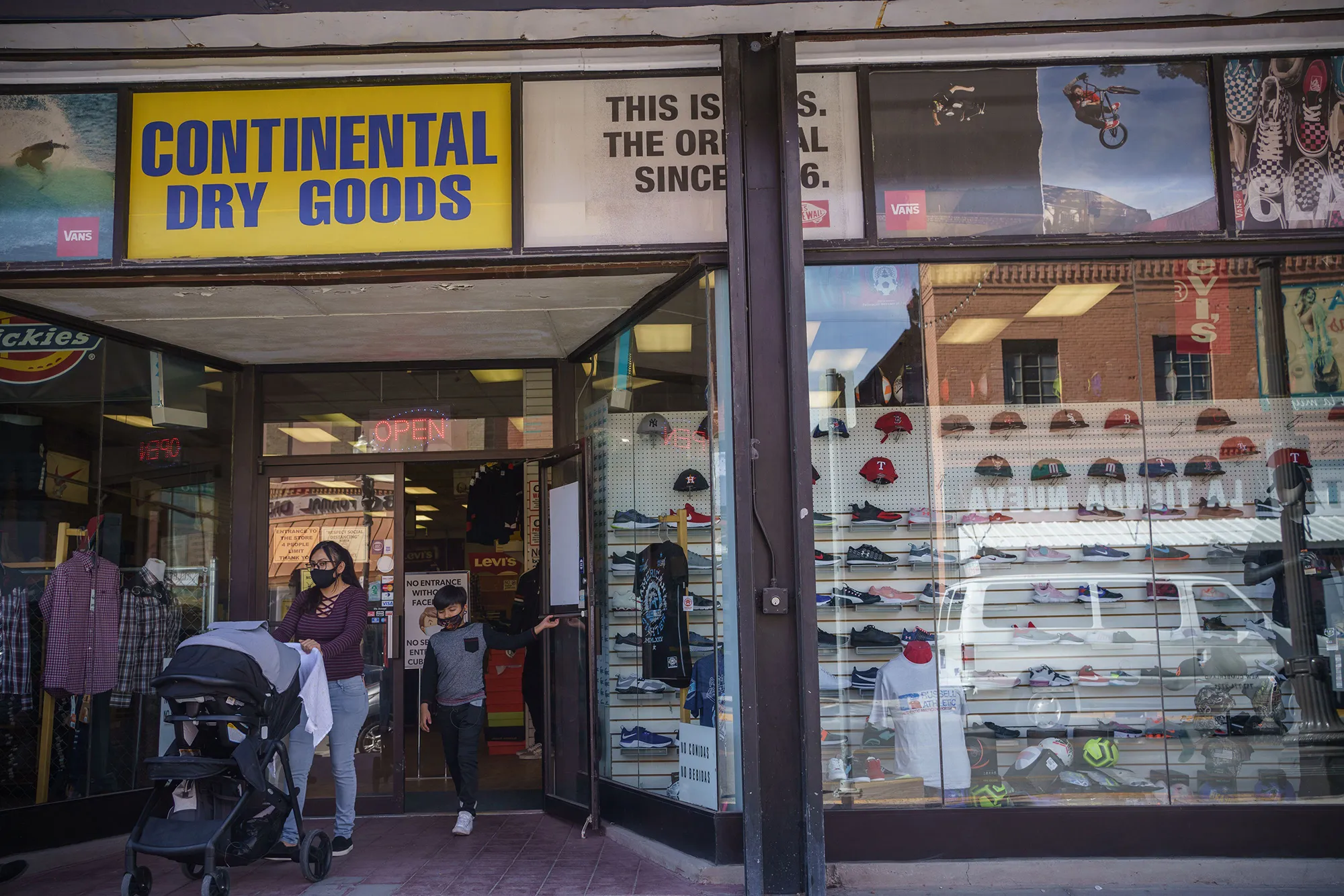 A shopper exits a store in El Paso on Oct. 26.
