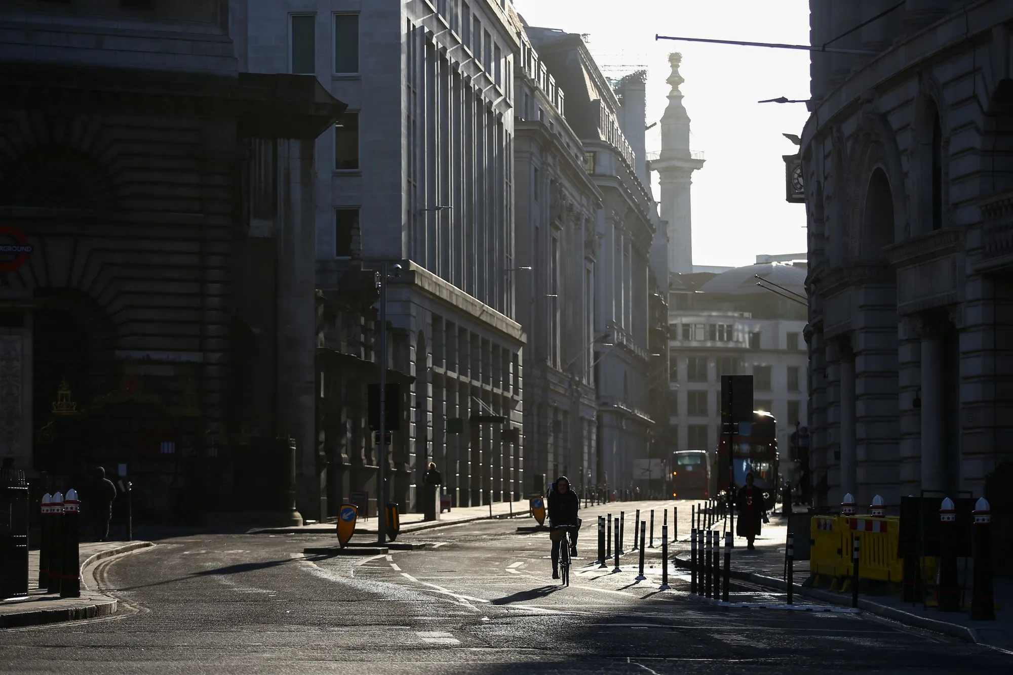 A cyclist rides through the district of Bank in London.