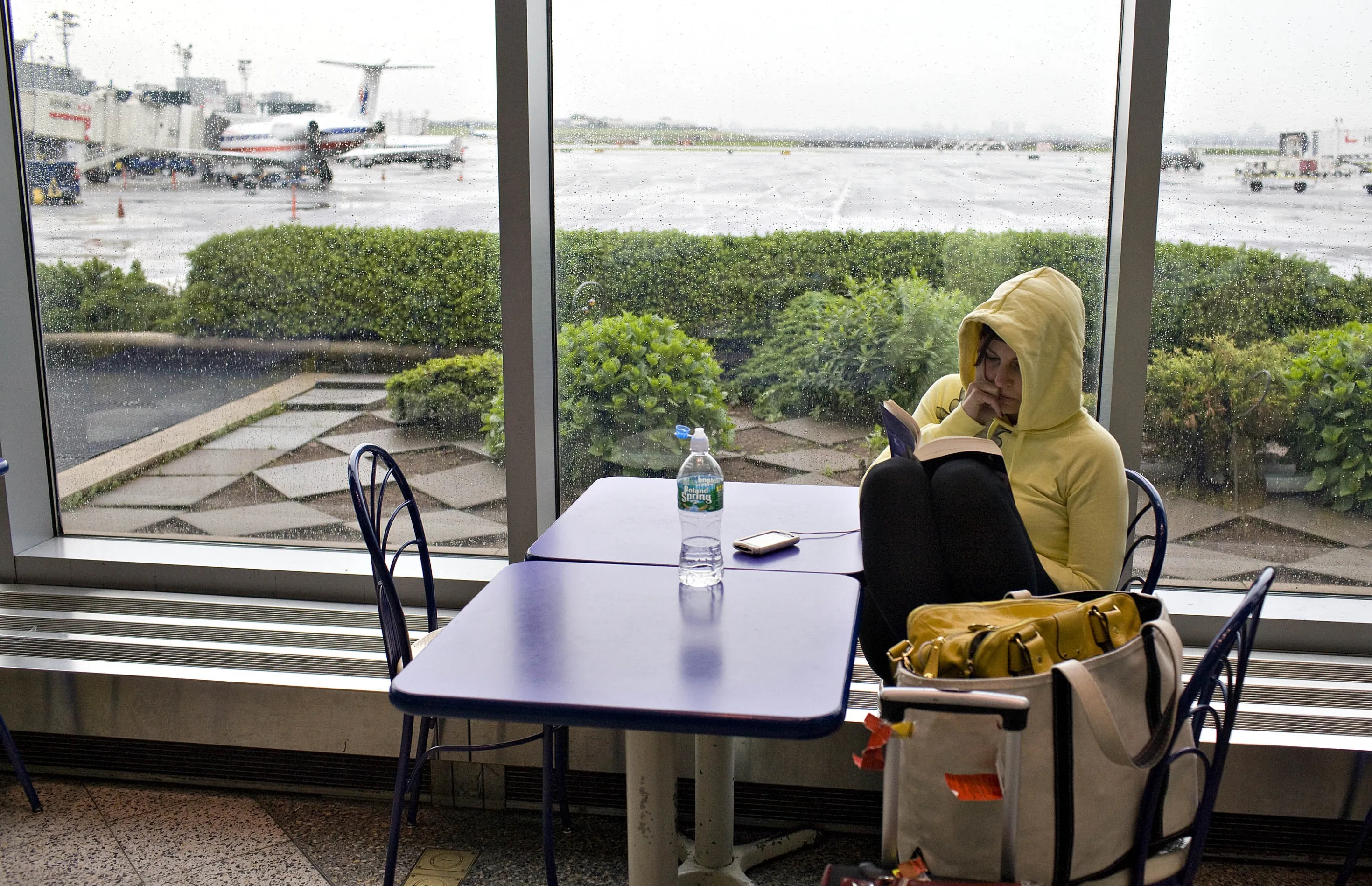 An Ohio-bound traveler waits at LaGuardia Airport in June 2009.
