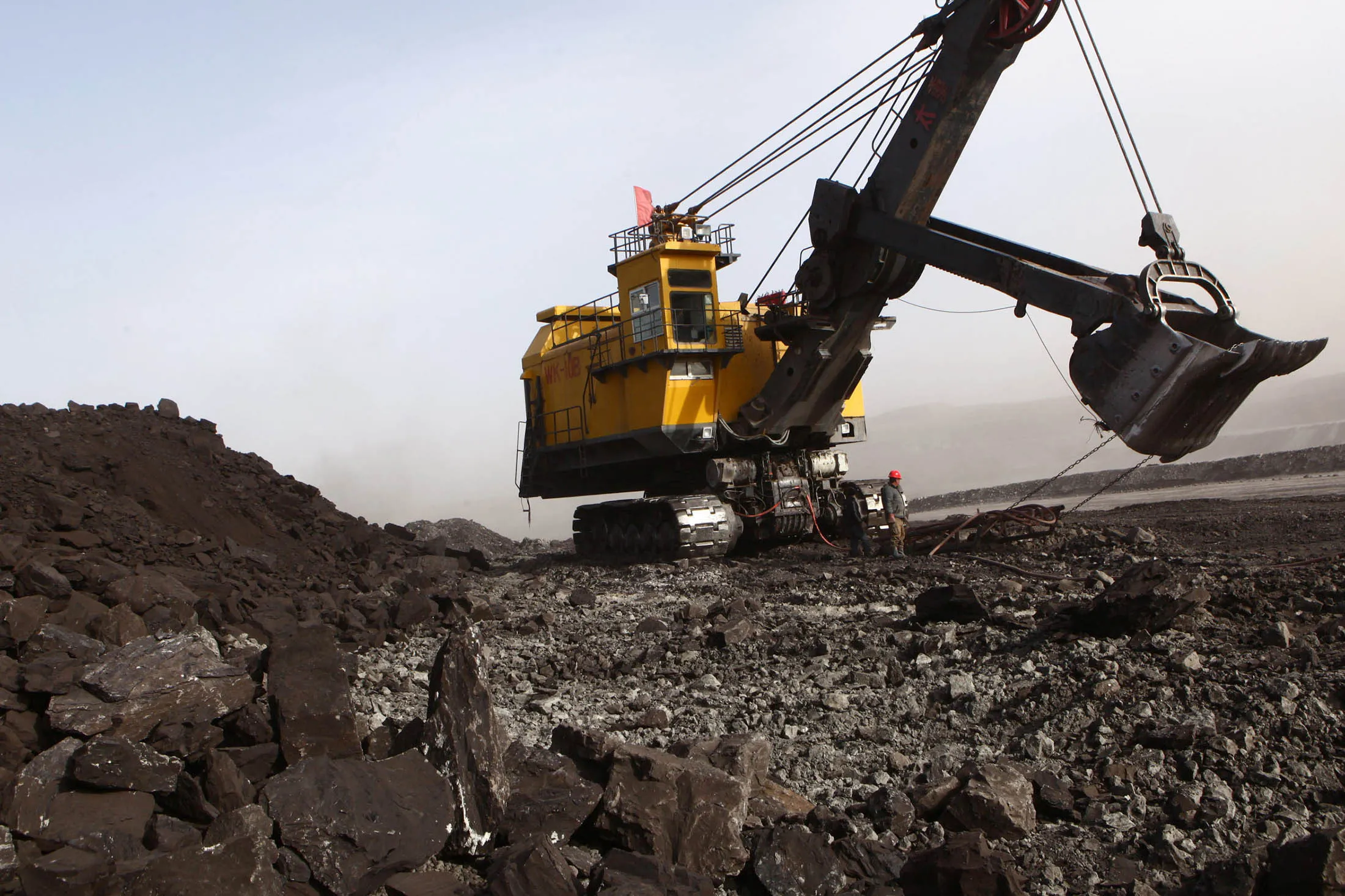 This photo taken on November 15, 2010 shows people working at a coal mine in Huo Lin Guo Le, China's north Inner Mongolia region. China appeared November 19 to soften its stance on a sticking point in UN climate change negotiations, the issue of verifying developing countries' emissions reductions. Beijing does not 'believe that increasing transparency will be a problem,' at global talks opening later this month in Mexico, said Huang Huikang, the Chinese foreign ministry's representative at the talks. AFP PHOTO / Gou Yige (Photo credit should read GOU YIGE/AFP/Getty Images)
