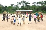 Children playing outside a primary school in the village of New Pohan, Liberia