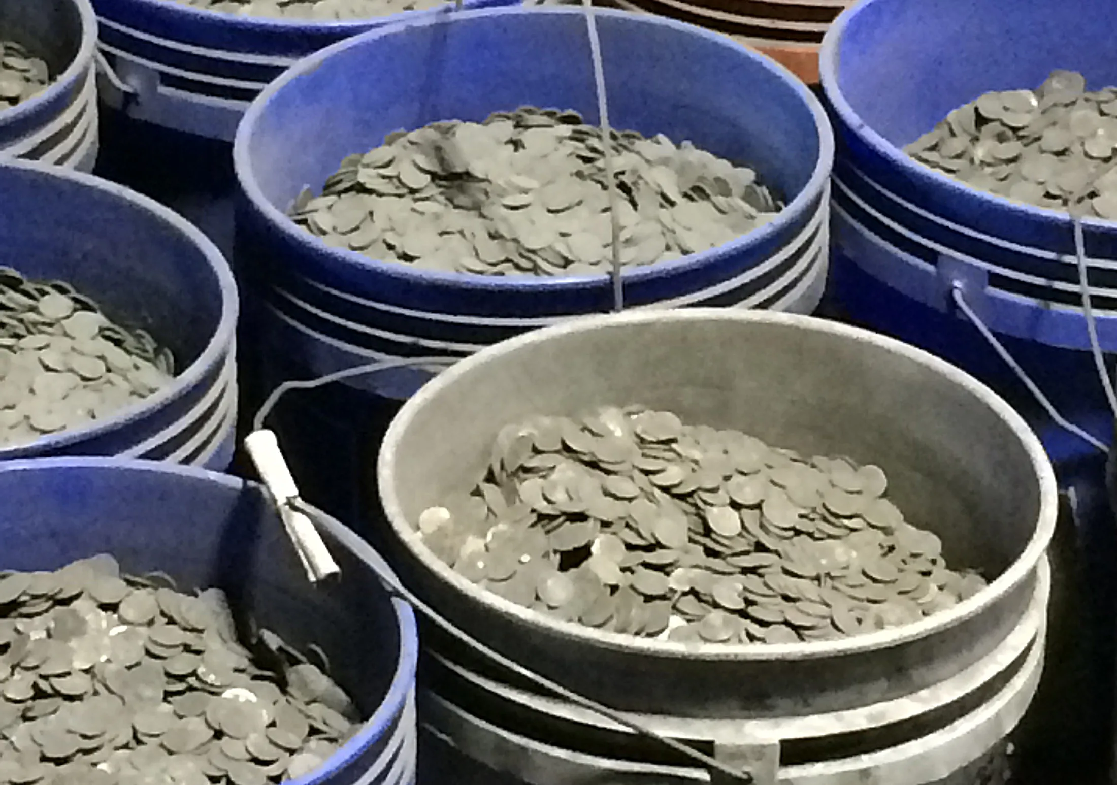 Trash Piles Yield Treasure as Sifters Seek Sooty Coins in Ashes - Bloomberg