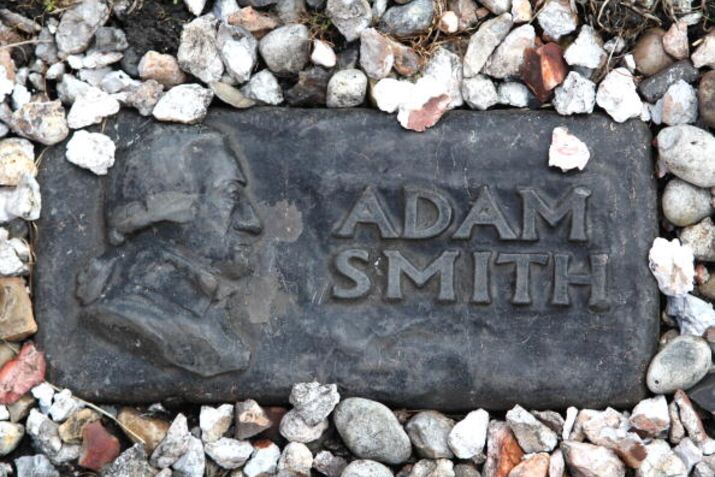 A marker leads the way to the grave of economist Adam Smith