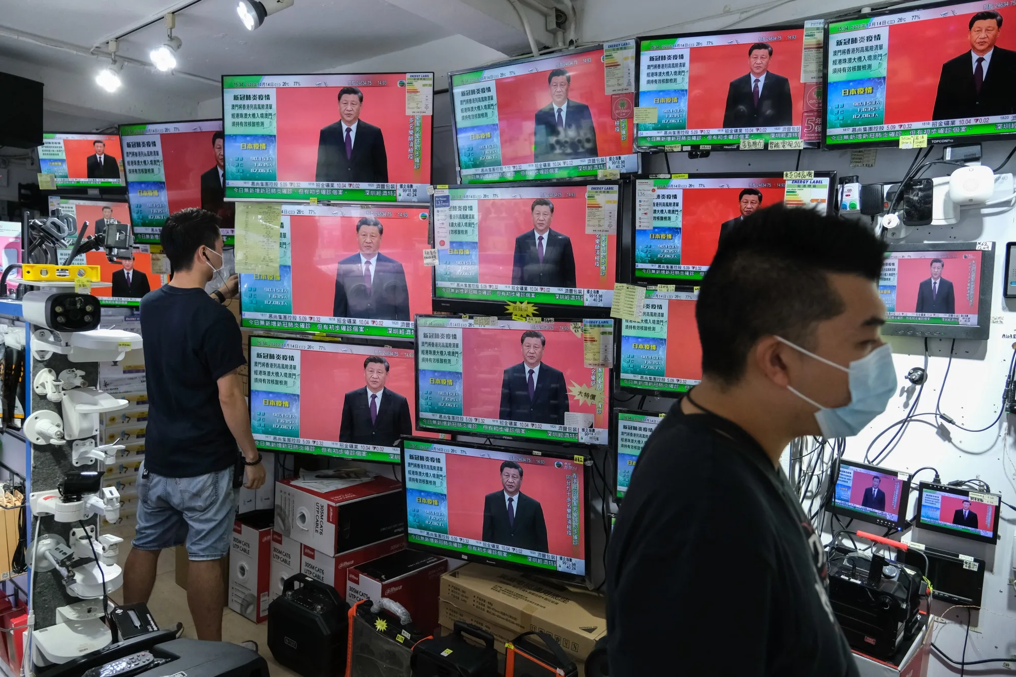 President Xi Jinping’s speech in Shenzhen is broadcasted inside a store in Hong Kong, Oct. 14.