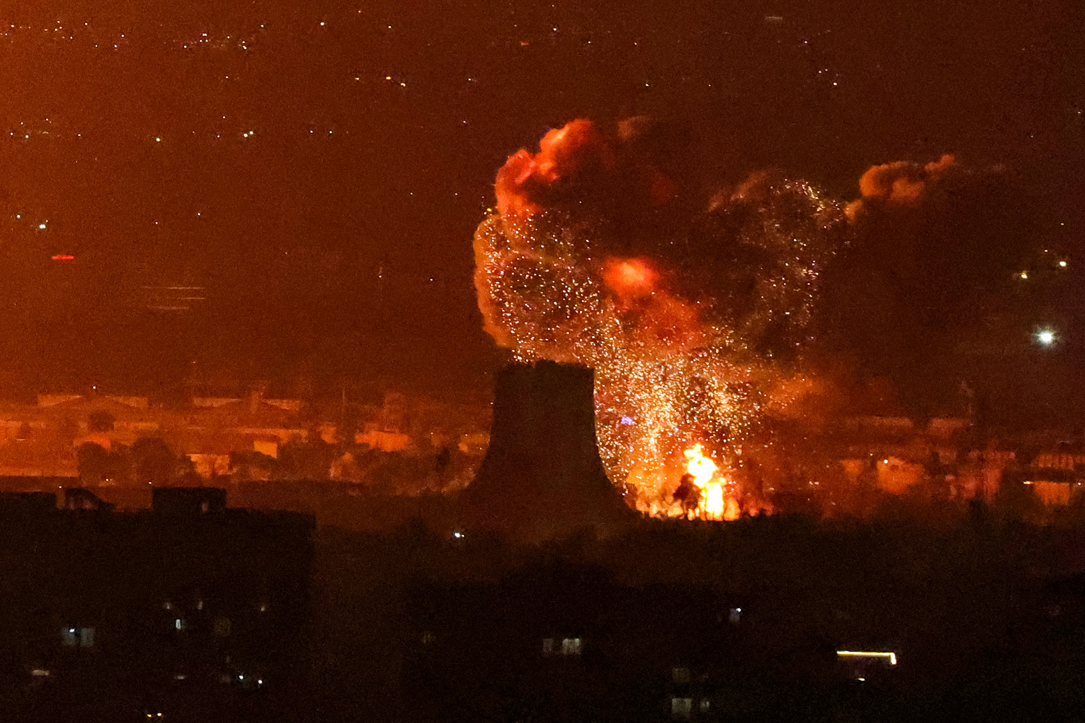 An explosion erupts following strikes near Azadi Tower close to Mehrabad International Airport in Tehran on March 7.