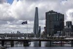 An Australian flag flies near the Crown Sydney hotel resort and the One Barangaroo Crown residences.