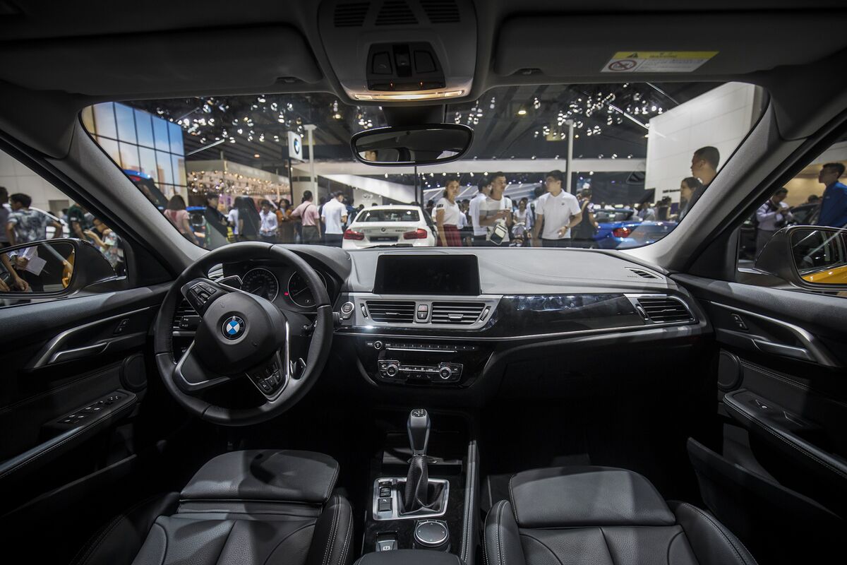 BMW, Tesla to Gain Most From Striking Out on Their Own in China - Bloomberg