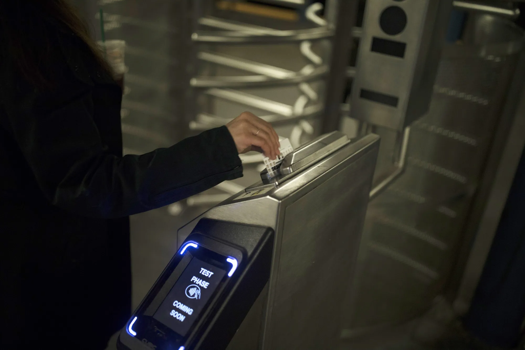 A commuter swipes a MetroCard on a turnstile&nbsp;at a subway station in New York.
