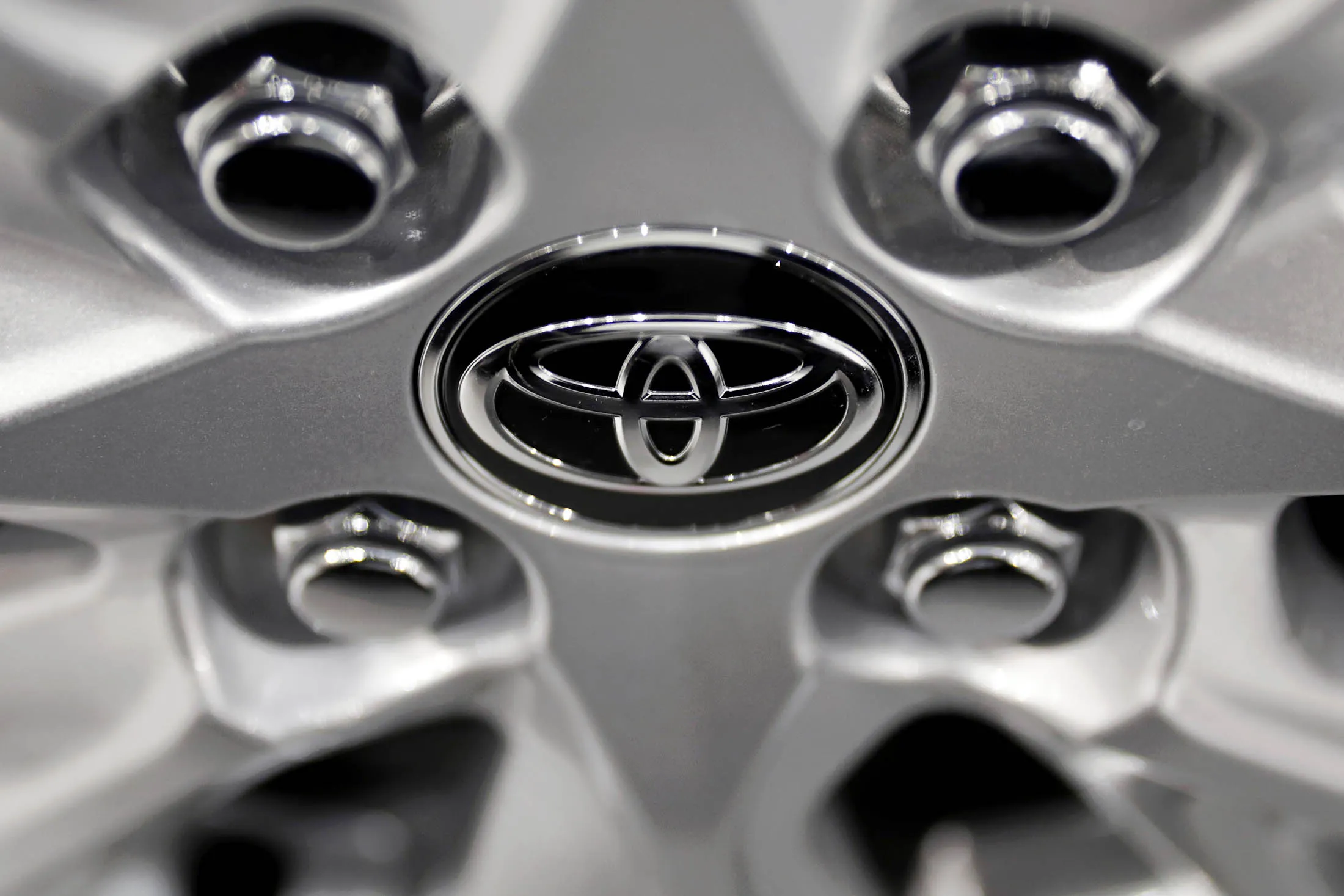A Toyota Motor Corp. badge is displayed on the wheel hub of a vehicle inside the Toyota City Showcase exhibit at the company's Mega Web car theme park in Tokyo, Japan, on Friday, Feb. 3, 2017. Toyota is scheduled to report third-quarter earnings figures on Feb. 6.
