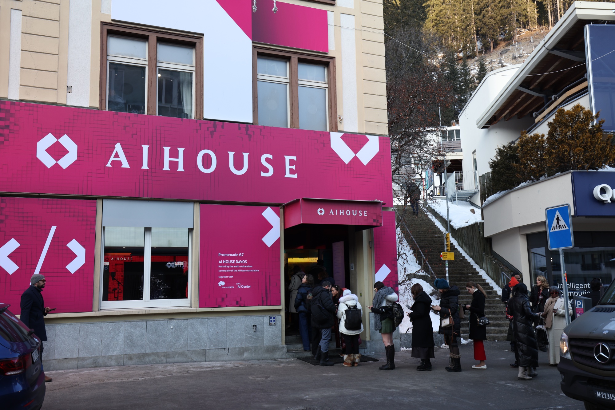 Attendees queue to enter an event at the AI House pavilion ahead of the World Economic Forum (WEF) in Davos, Switzerland, on Monday, Jan. 19, 2026. The annual Davos gathering of political leaders, top executives and celebrities runs from Jan. 19-23. Photographer: Krisztian Bocsi/Bloomberg