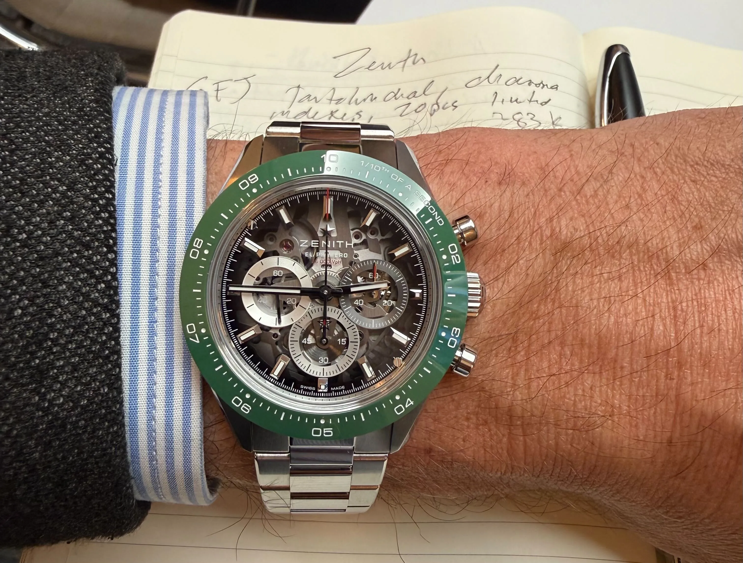 A Zenith Chronomaster Sport Skeleton watch with a green bezel.