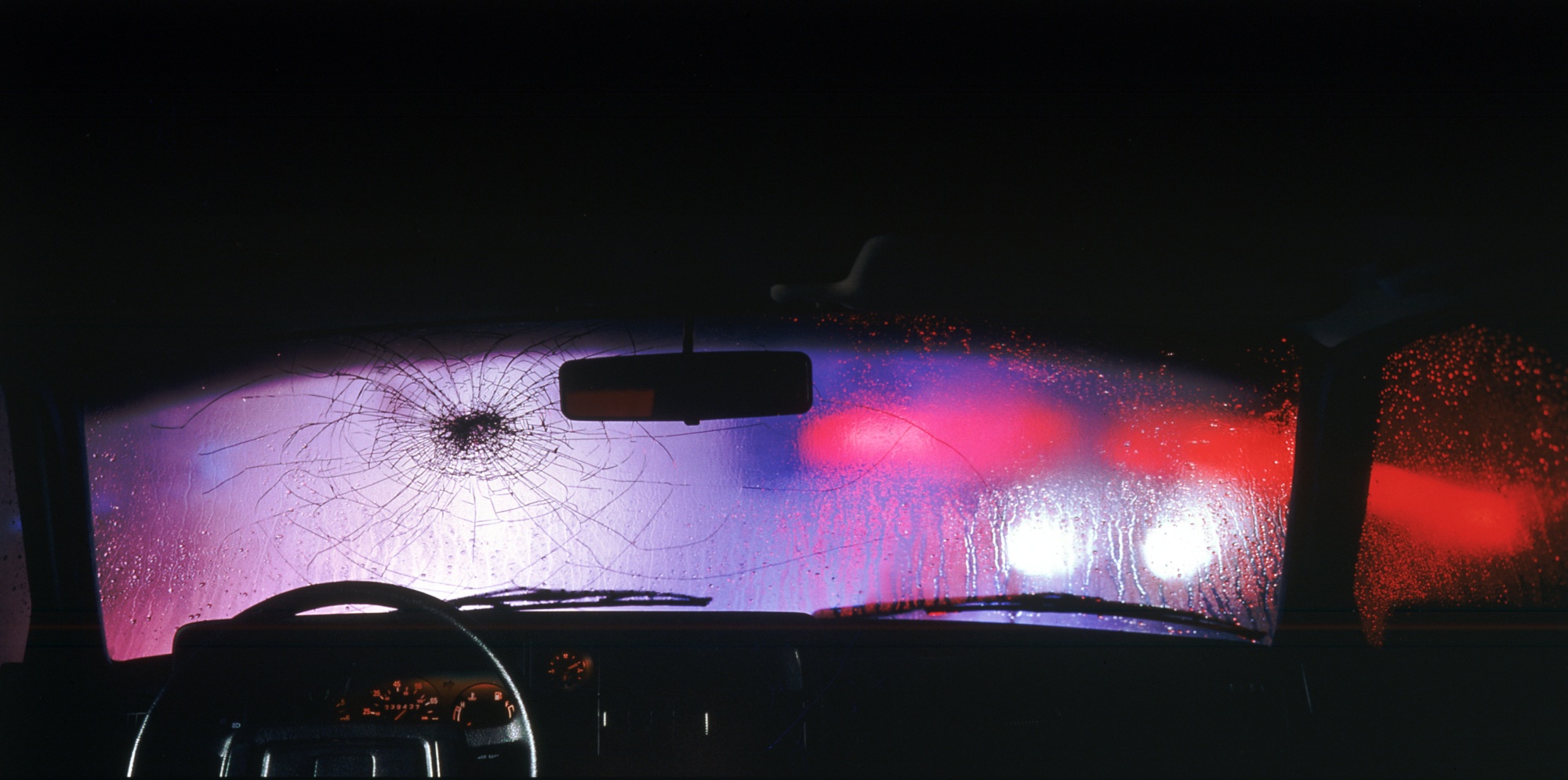broken car window from car bomb in crime scene Stock Photo