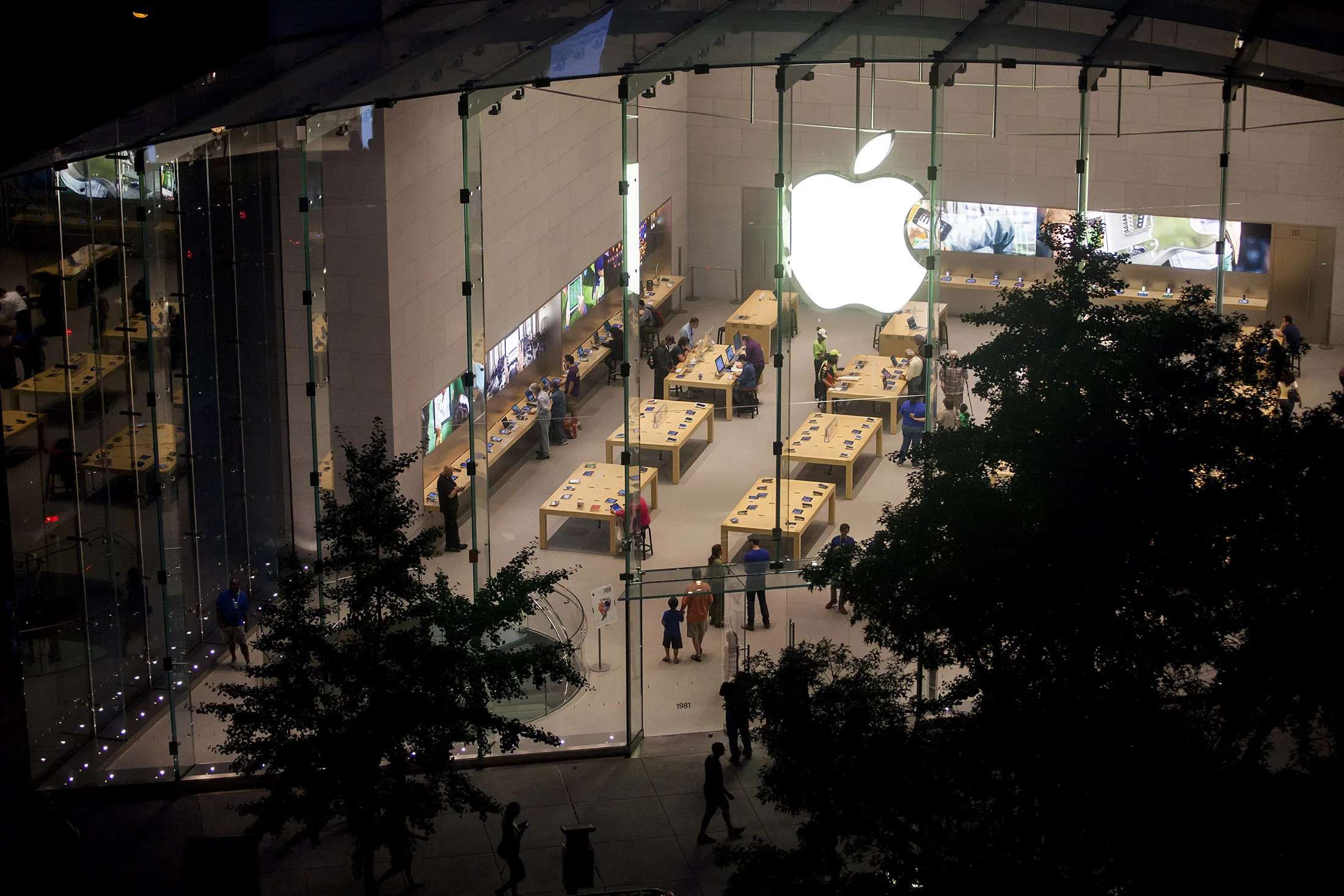 Shoppers look at products at the Upper West Side Apple Inc. store in New York.

