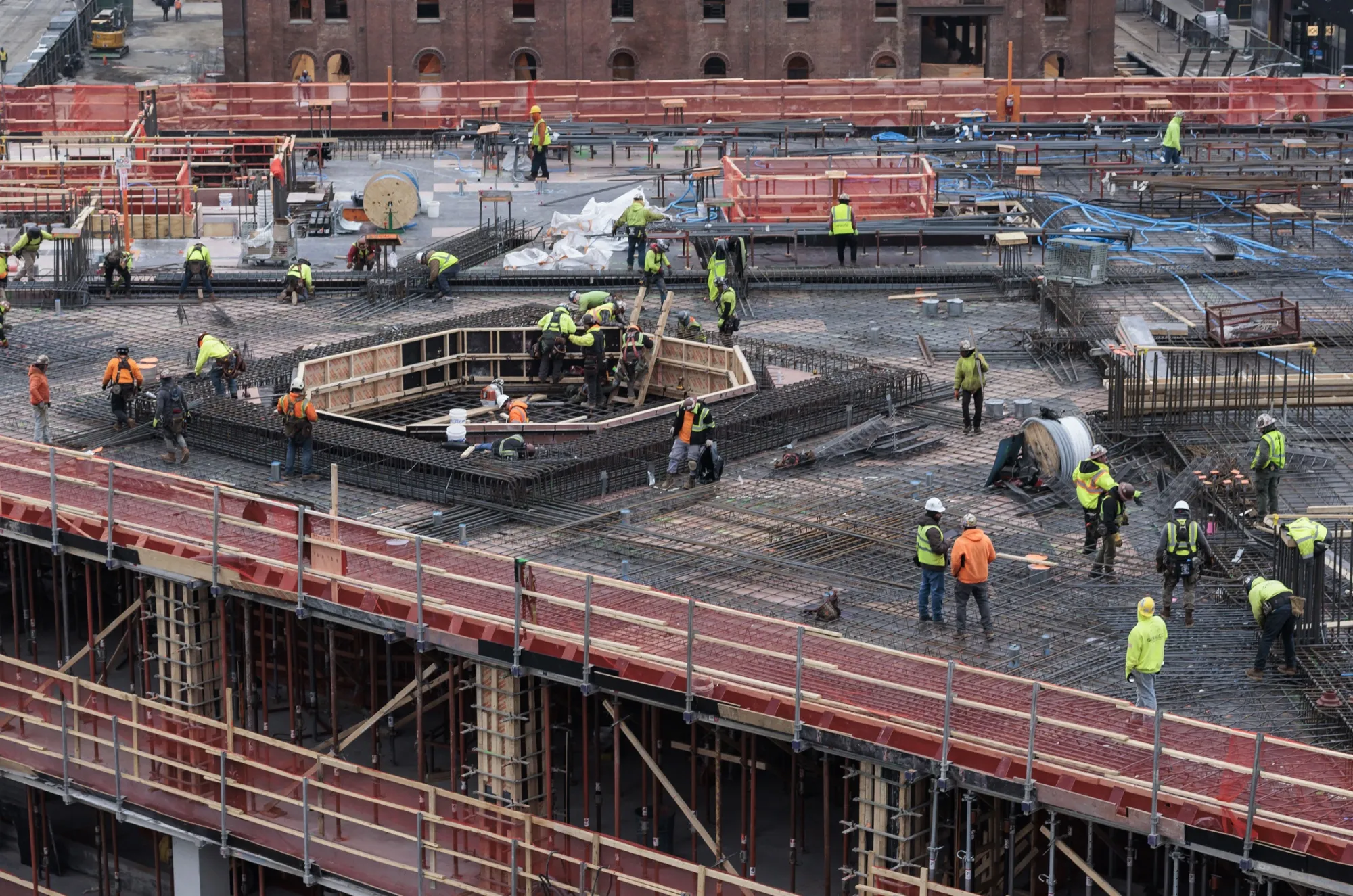 Construction workers in Brooklyn, New York. An influx of immigrants has eased pressure in what has been a tight labor market.