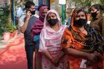 People line up at a Covid-19 vaccination center in New Delhi, India.