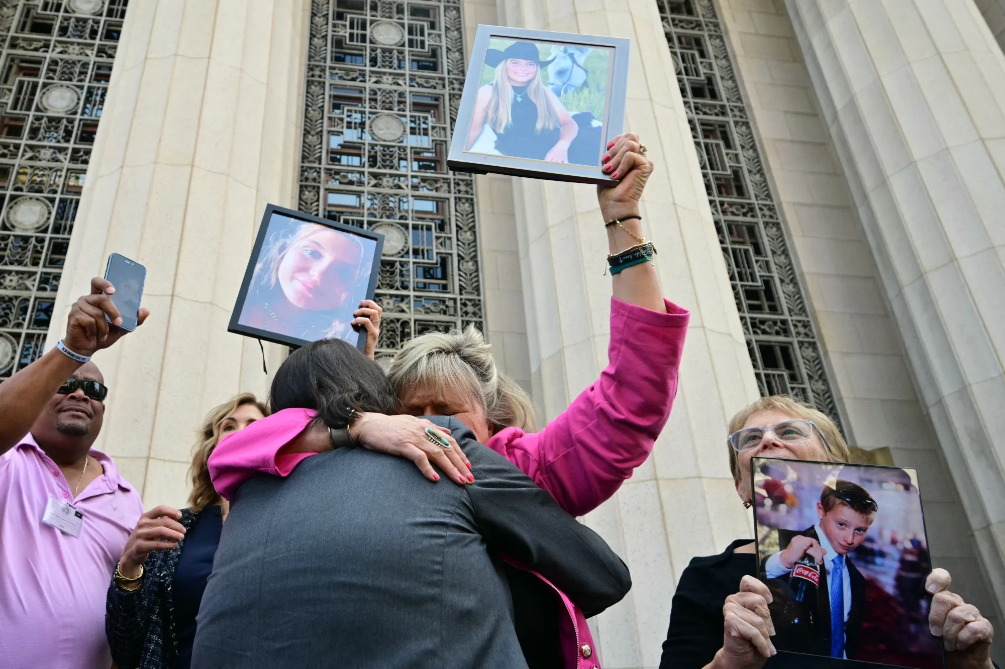 Relatives of victims outside of the Los Angeles Superior Court&nbsp;in Los Angeles&nbsp;on March 25.&nbsp;