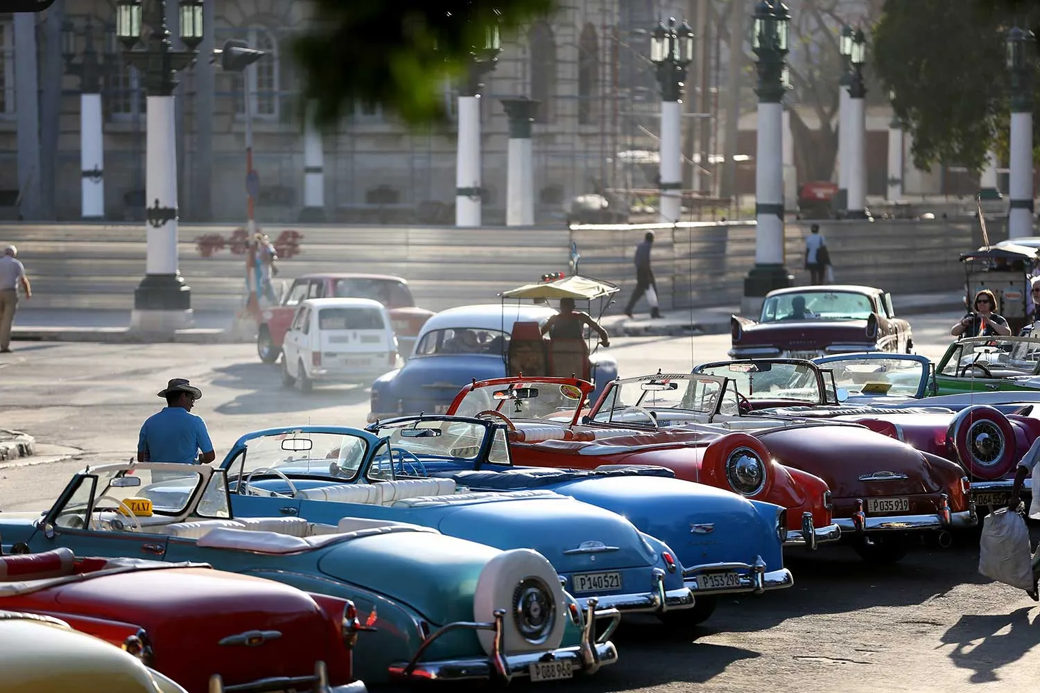 Vintage American automobiles are seen on the street as their owners wait for tourists wanting a ride a day after the second round of diplomatic talks between the United States and Cuban officials took place in Washington, DC on February 28, 2015 in Havana, Cuba. The dialogue is an effort to restore full diplomatic relations and move toward opening trade.
