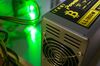 A bitcoin logo sits on a LL 1800W power unit supplying cryptocurrency mining machines at the SberBit mining 'hotel.'