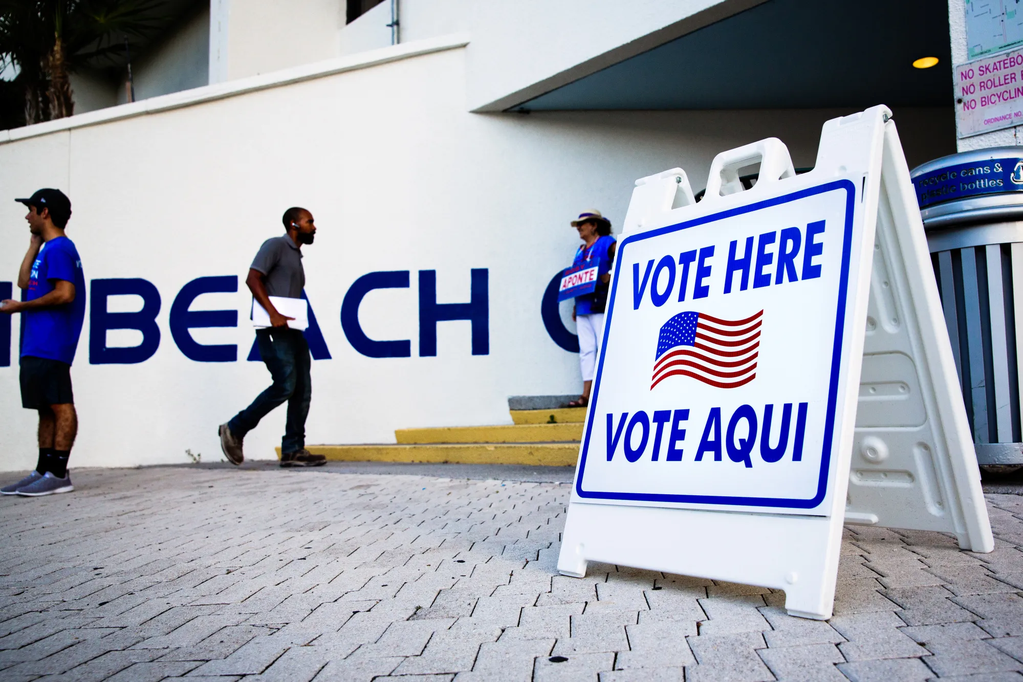 A "Vote Here" sign stands on display outside a polling location in Miami Beach, Florida.&nbsp;