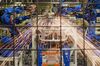 Robots weld together stamped out metal parts at the Subaru of Indiana Automotive Inc. (SIA) assembly plant in Lafayette, Indiana, U.S., on Thursday, July 24, 2014. Subaru of Indiana Automotive Inc., the only Subaru auto assembly plant in the U.S., manufactures the Outback and Legacy line of vehicles.