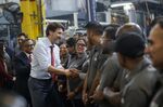 Trudeau greets employees at a factory in Brampton, Ontario